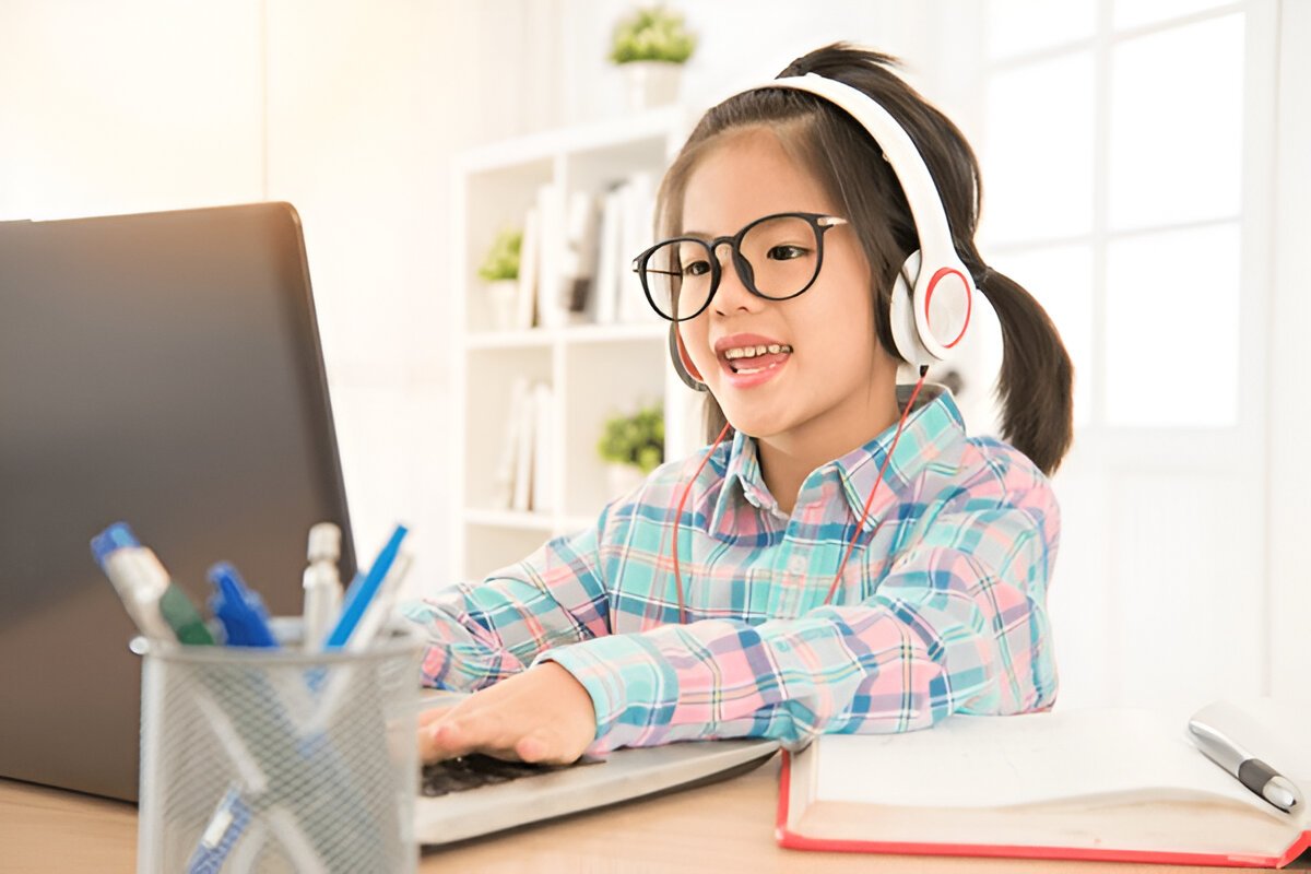 Student using laptop and notebook to study online with top educational resources